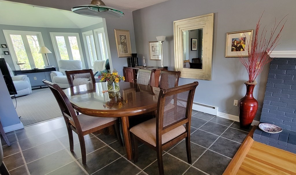 185 Evelyn Road Needham, MA 02494 - Photo 6 of 23 a view of a dining room with furniture and chandelier