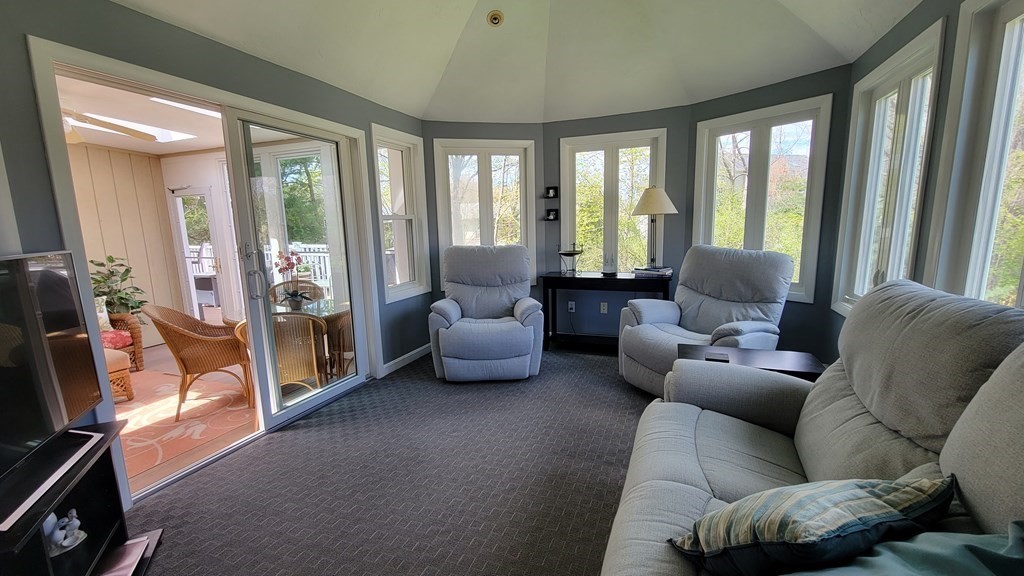 185 Evelyn Road Needham, MA 02494 - Photo 8 of 23 a living room with furniture and a floor to ceiling window