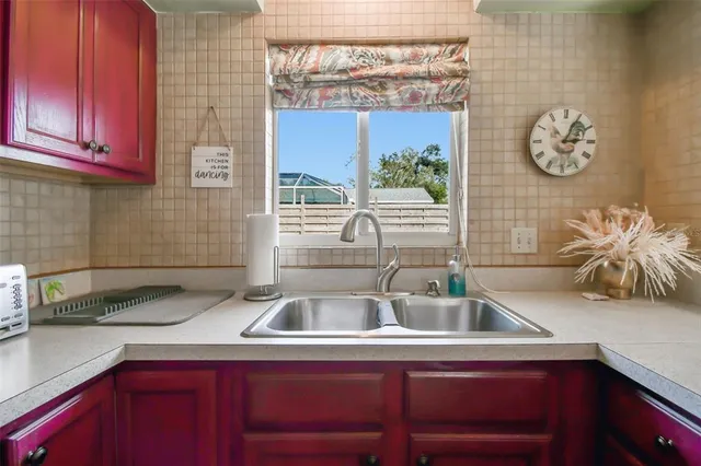 a kitchen with a sink and a stove