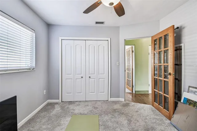 a bathroom with a toilet a sink and a mirror