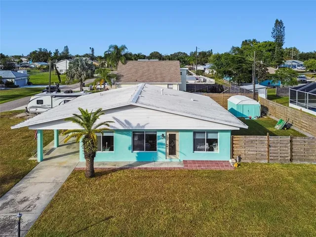 an aerial view of a house with a swimming pool