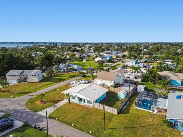 an aerial view of residential houses with outdoor space