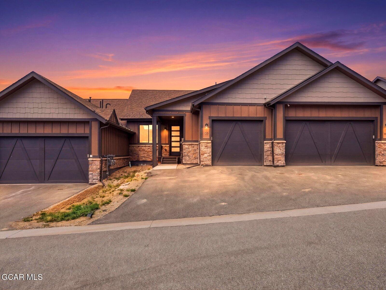 95 River Run Circle Fraser, CO 80442 - Photo 1 of 66 a front view of a house with a yard and garage