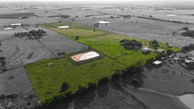 an aerial view of a golf course with parking space