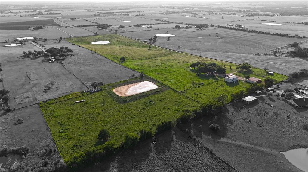 an aerial view of a golf course with parking space