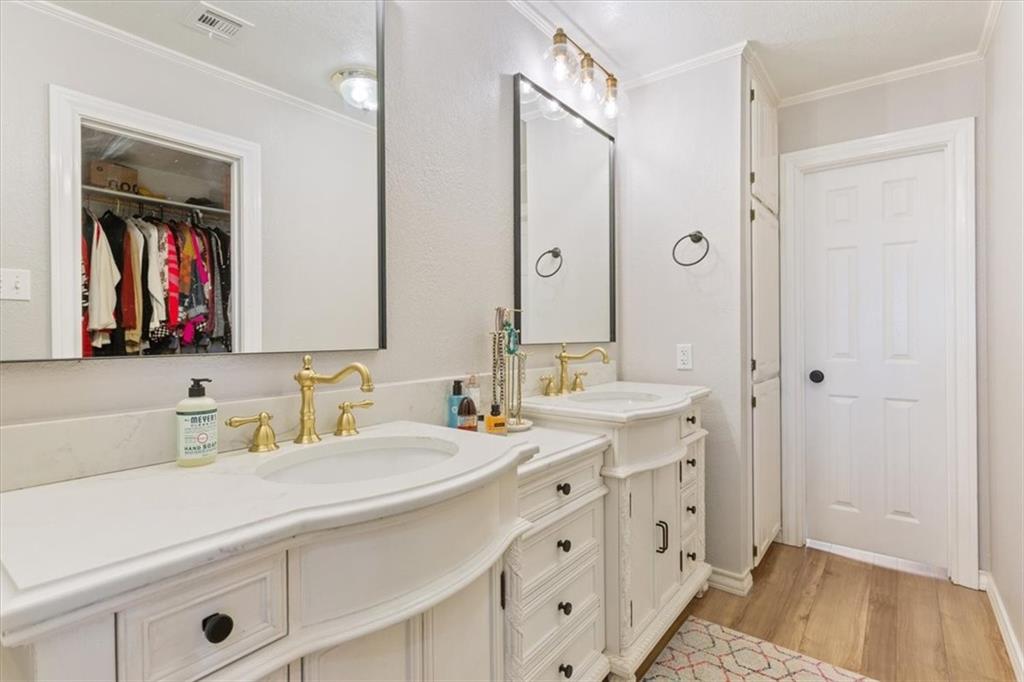 347 Howe Hill Road Lorena, TX 76655 - Photo 15 of 38 a bathroom with a double vanity sink mirror and