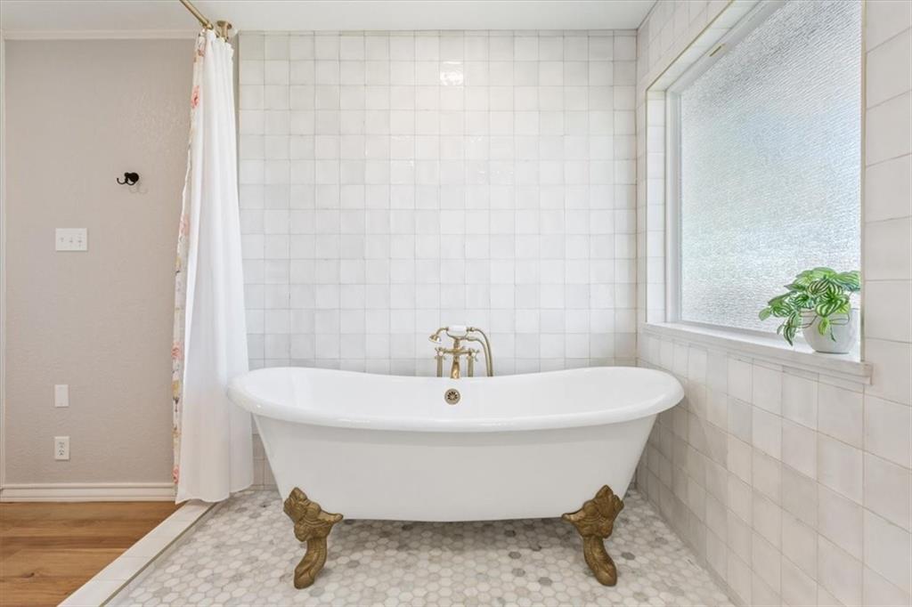 347 Howe Hill Road Lorena, TX 76655 - Photo 16 of 38 a white bath tub sitting in a bathroom