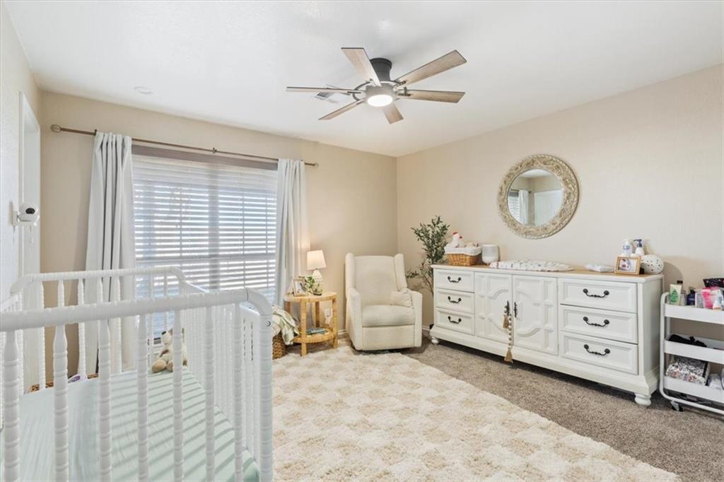 347 Howe Hill Road Lorena, TX 76655 - Photo 18 of 38 a view of a bedroom with furniture and a window