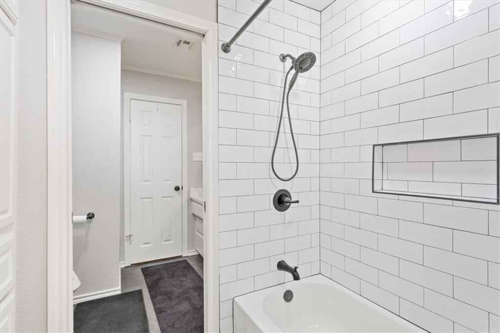 347 Howe Hill Road Lorena, TX 76655 - Photo 20 of 38 a bathroom with a shower and a bathtub