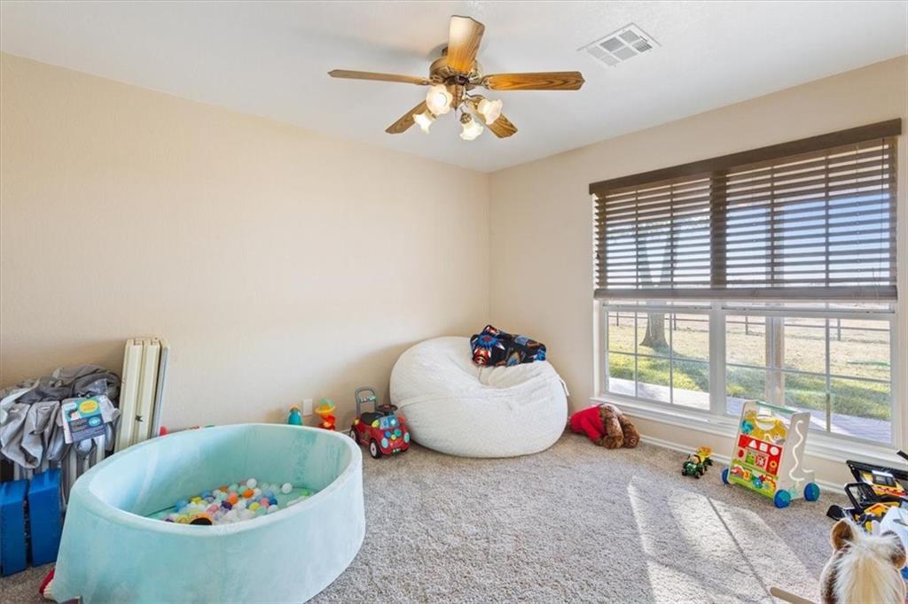 347 Howe Hill Road Lorena, TX 76655 - Photo 21 of 38 a room with toys and a chandelier