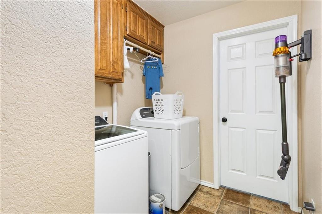 347 Howe Hill Road Lorena, TX 76655 - Photo 23 of 38 a utility room with dryer and washer