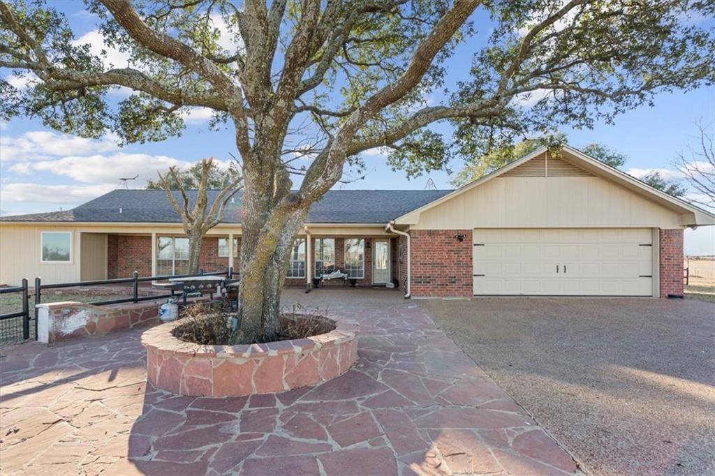 347 Howe Hill Road Lorena, TX 76655 - Photo 24 of 38 a front view of house with yard outdoor seating and covered with trees