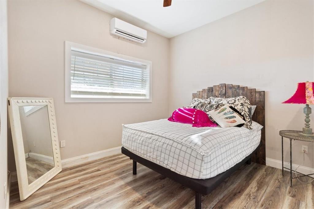 347 Howe Hill Road Lorena, TX 76655 - Photo 29 of 38 a bedroom with a bed and a table