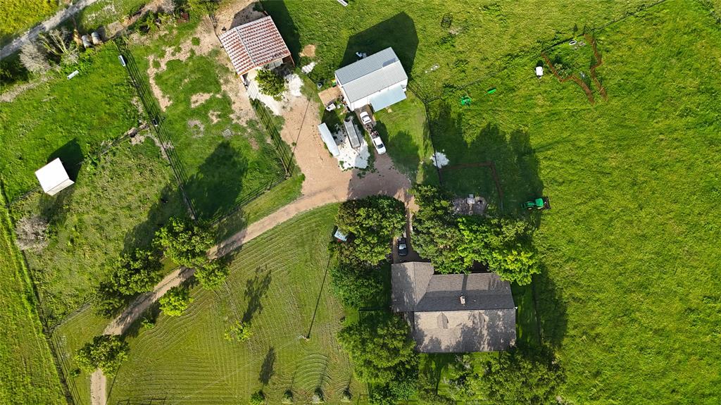 347 Howe Hill Road Lorena, TX 76655 - Photo 37 of 38 an aerial view of residential house with outdoor space and trees all around