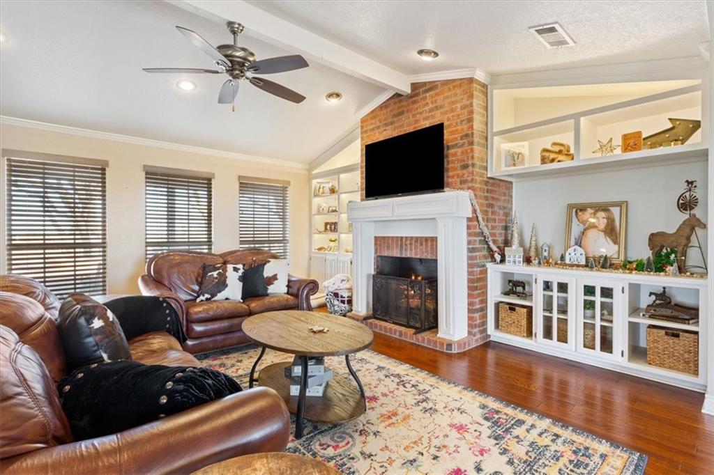 347 Howe Hill Road Lorena, TX 76655 - Photo 6 of 38 a living room with furniture fireplace and flat screen tv