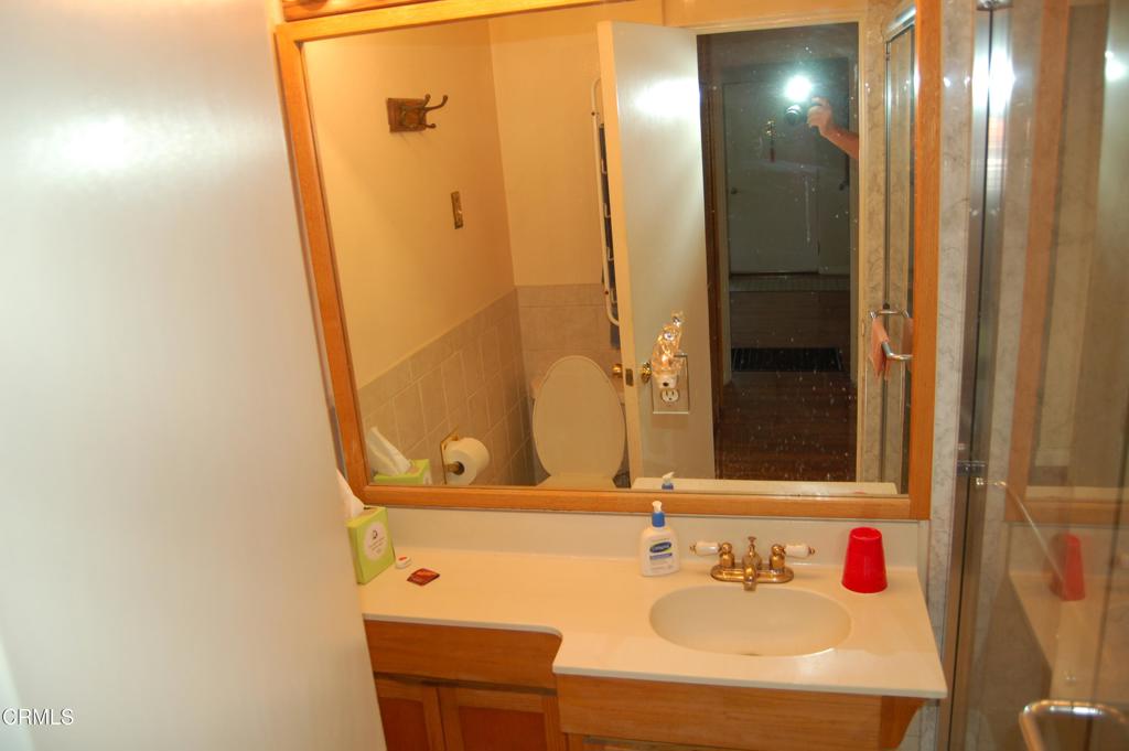 3912 Mohawk Street Pasadena, CA 91107 - Photo 13 of 24 a bathroom with a sink and a mirror