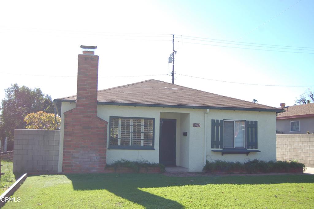 3912 Mohawk Street Pasadena, CA 91107 - Photo 2 of 24 a front view of a house with a yard