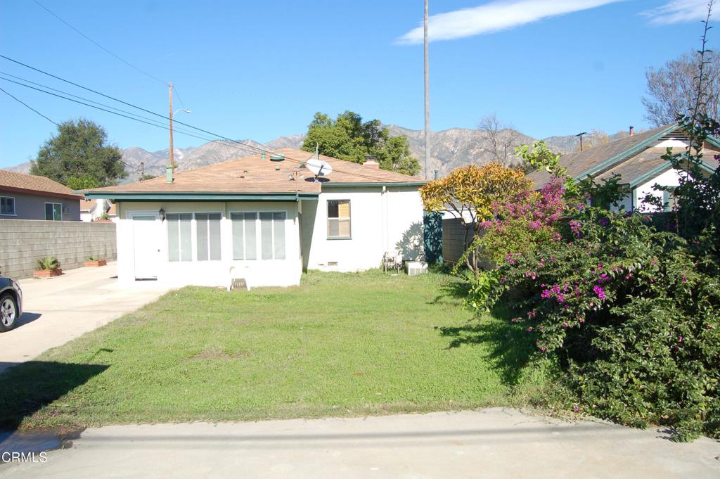 3912 Mohawk Street Pasadena, CA 91107 - Photo 22 of 24 a front view of a house with a garden