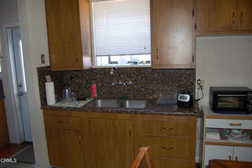3912 Mohawk Street Pasadena, CA 91107 - Photo 7 of 24 a kitchen with a sink and cabinets