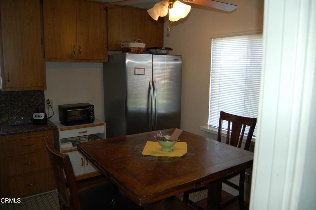 3912 Mohawk Street Pasadena, CA 91107 - Photo 9 of 24 a kitchen with a table chairs and refrigerator