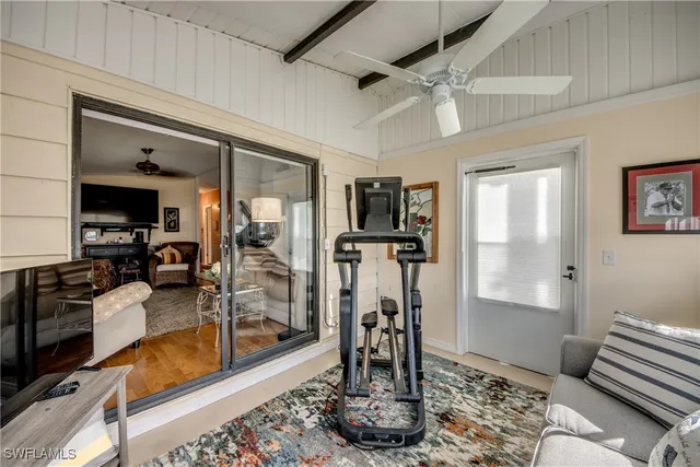 a view of a dining room with furniture and window