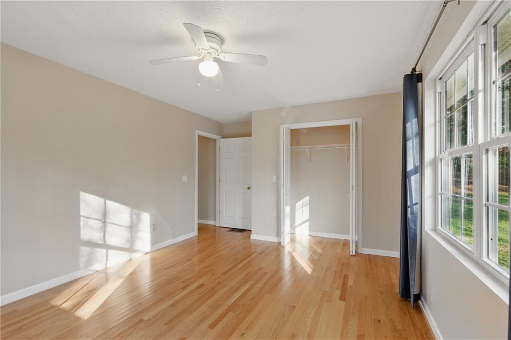 218 Eden Woods Clarkesville, GA 30523 - Photo 13 of 35 a view of an empty room with wooden floor and a window