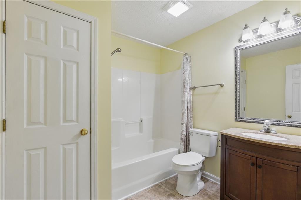 218 Eden Woods Clarkesville, GA 30523 - Photo 14 of 35 a bathroom with a sink toilet and shower