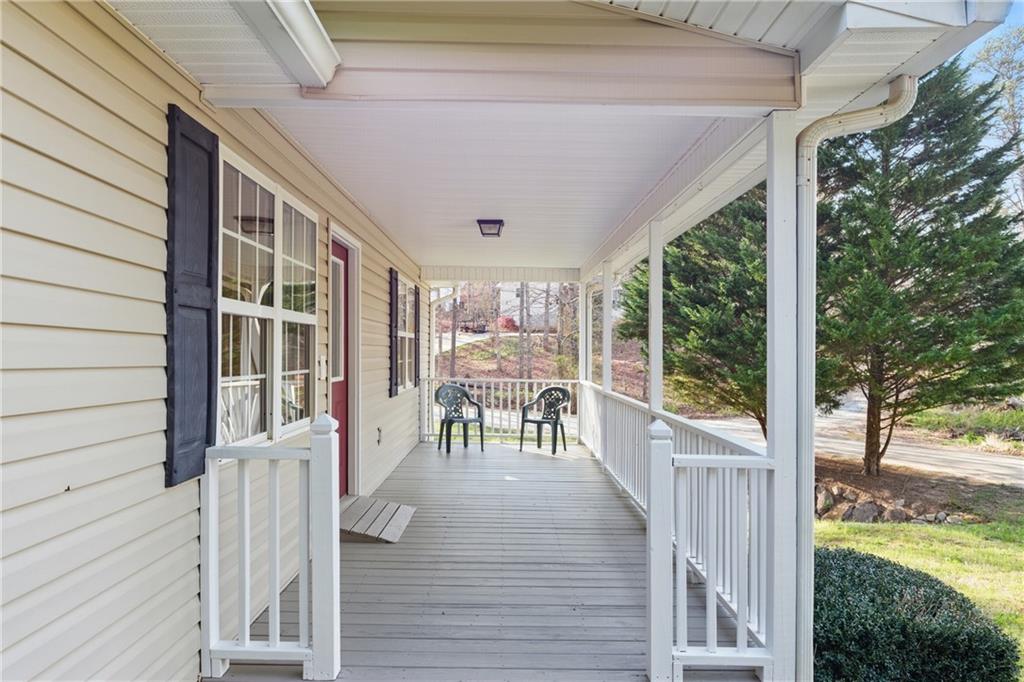 218 Eden Woods Clarkesville, GA 30523 - Photo 2 of 35 a porch with chairs and wooden floor