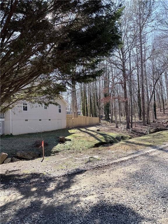 218 Eden Woods Clarkesville, GA 30523 - Photo 23 of 35 a view of a backyard with wooden fence and a bench