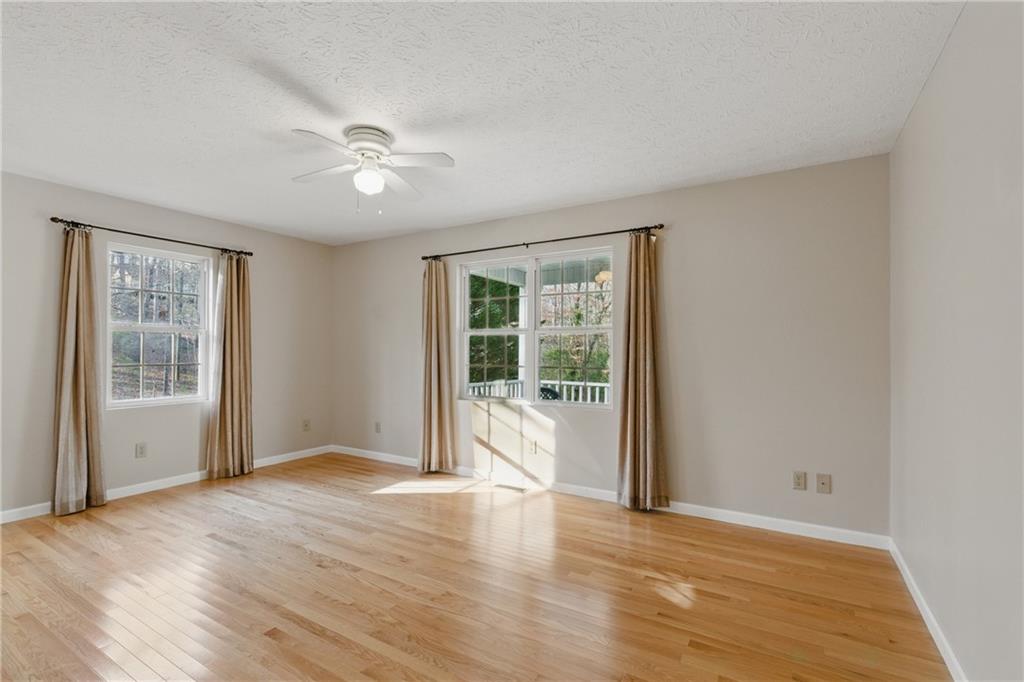 218 Eden Woods Clarkesville, GA 30523 - Photo 8 of 35 a view of an empty room with a window and wooden floor