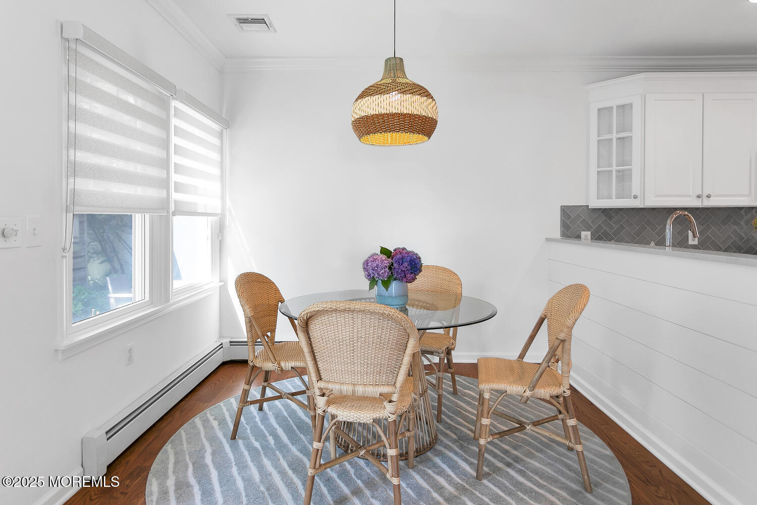 306 Ocean Road Spring Lake, NJ 07762 - Photo 11 of 45 a view of a dining room with furniture and a window