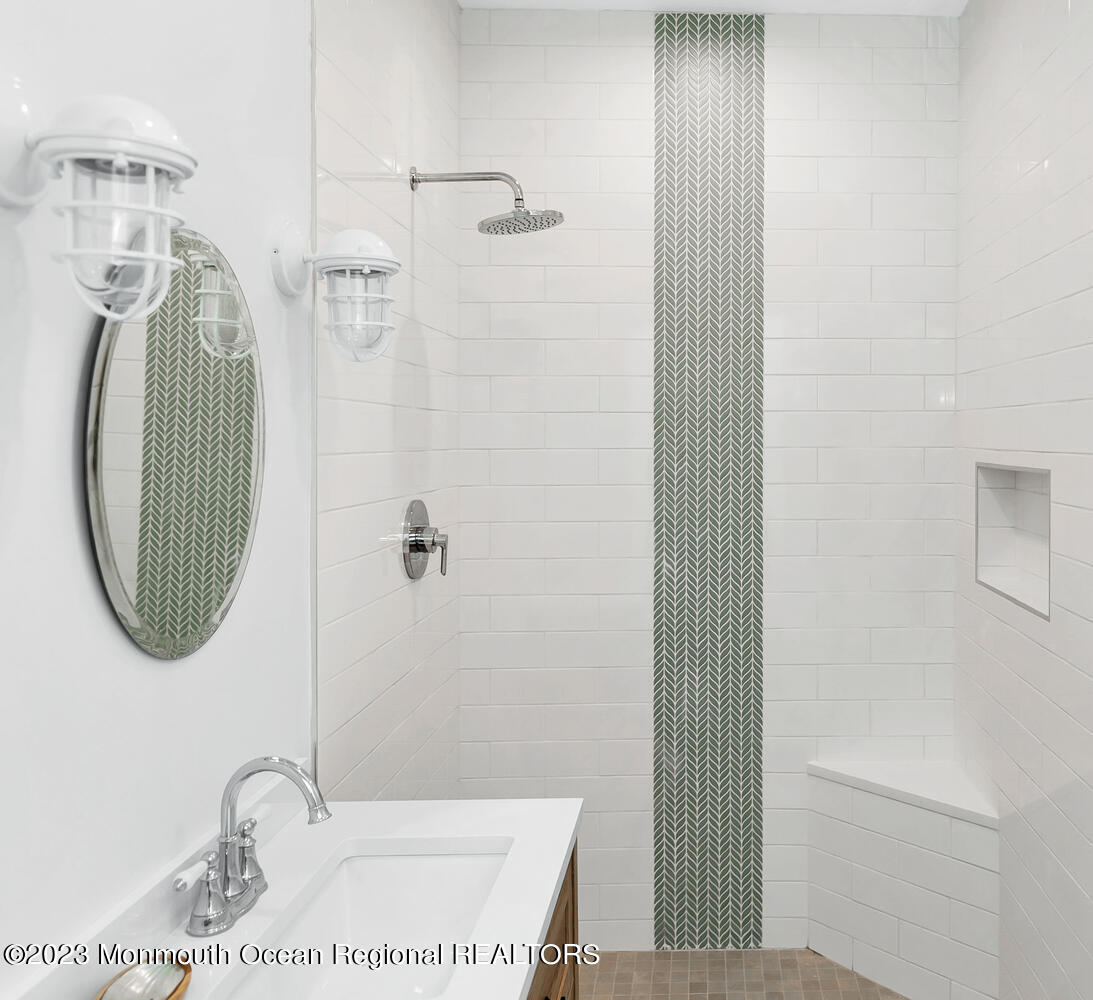 306 Ocean Road Spring Lake, NJ 07762 - Photo 12 of 45 a bathroom with a sink and a mirror