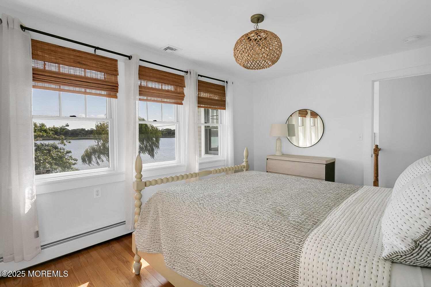 306 Ocean Road Spring Lake, NJ 07762 - Photo 18 of 45 a bedroom with a large bed and a window