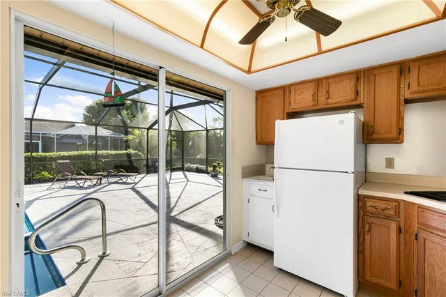 a view of a kitchen with a refrigerator and a table