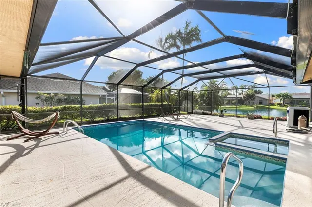 a view of a swimming pool with a patio