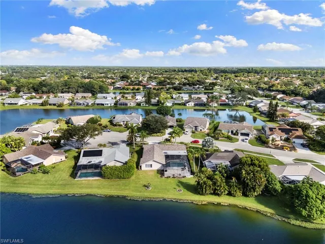 an aerial view of a house with a lake view