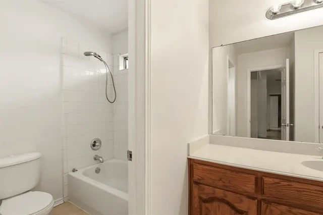 a bathroom with a toilet sink and shower