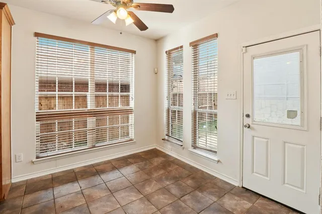 a view of an empty room with windows
