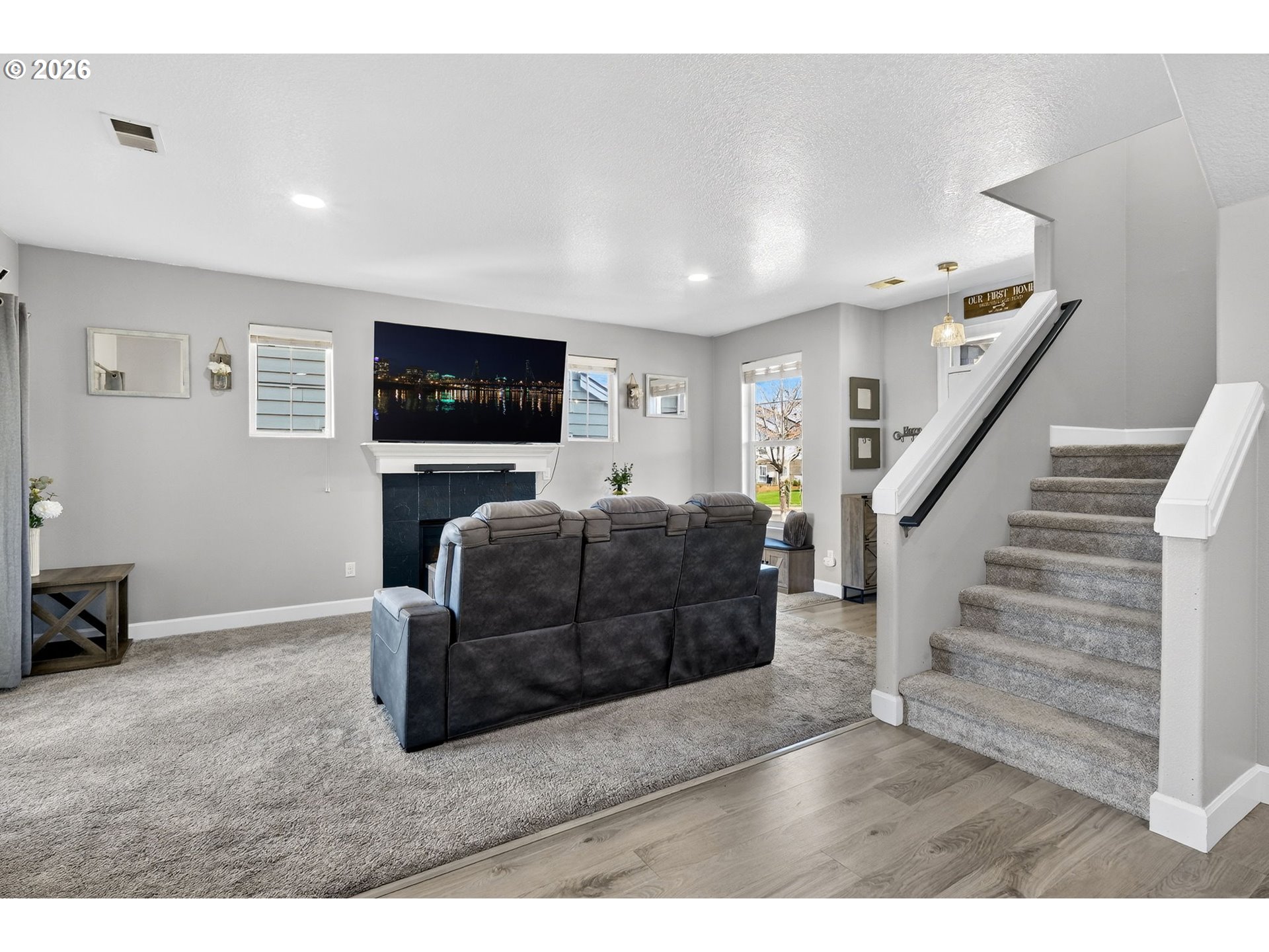 19135 Southeast Village Boulevard Sandy, OR 97055 - Photo 12 of 43 a living room with furniture and a flat screen tv