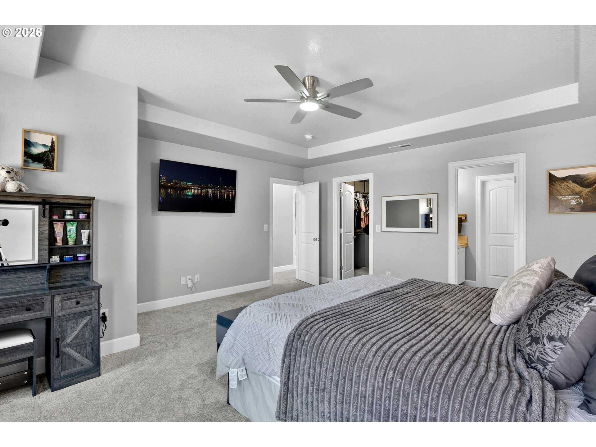 19135 Southeast Village Boulevard Sandy, OR 97055 - Photo 23 of 43 a bedroom with a large bed a flat tv screen and dresser