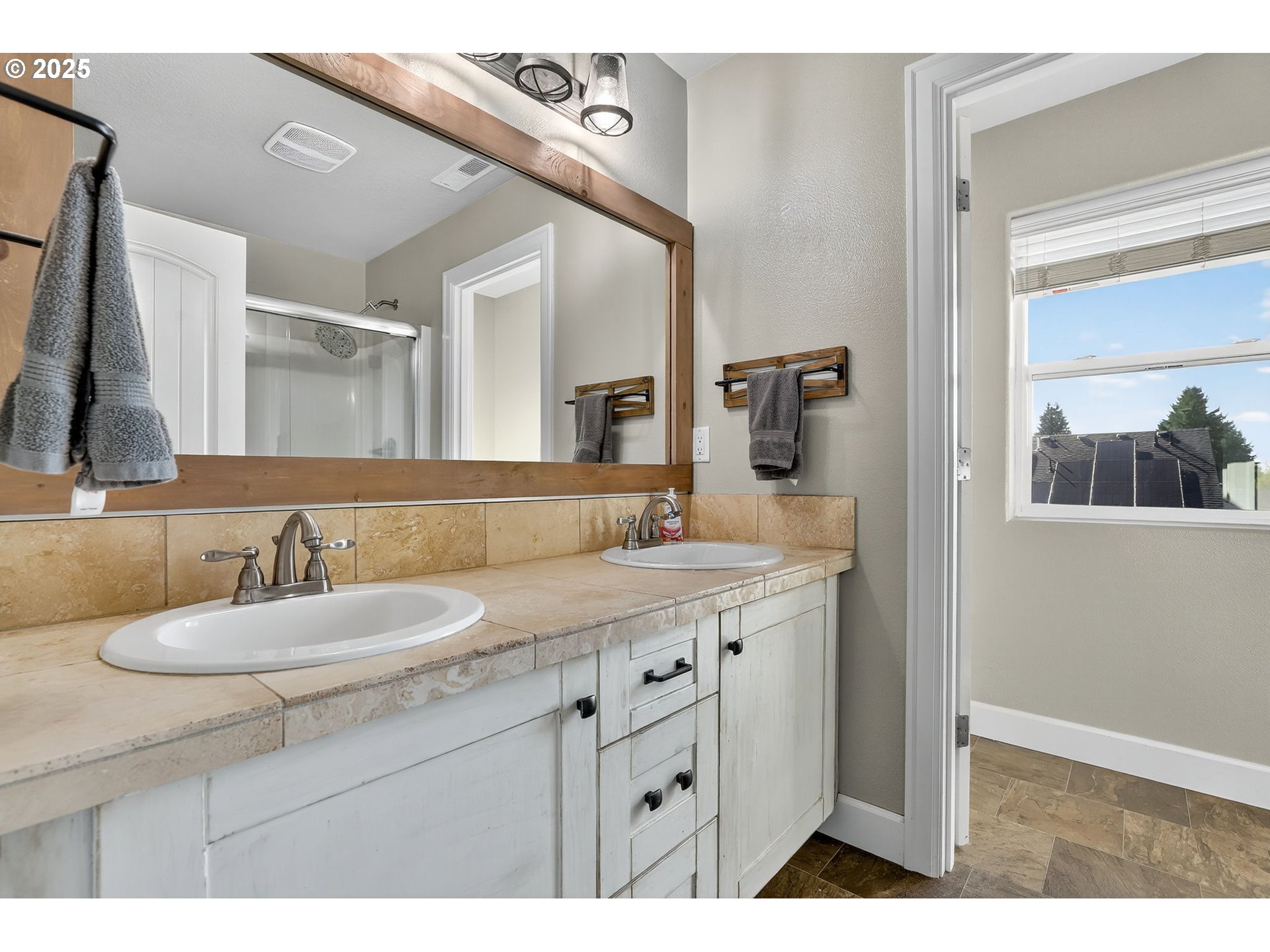 19135 Southeast Village Boulevard Sandy, OR 97055 - Photo 25 of 43 a bathroom with a sink and a mirror