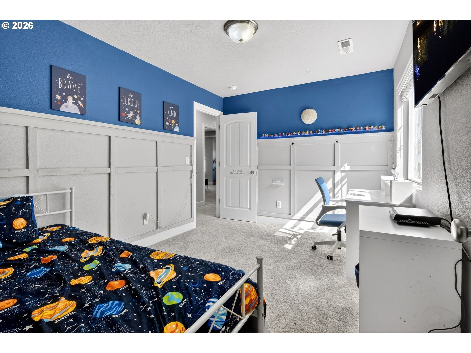 19135 Southeast Village Boulevard Sandy, OR 97055 - Photo 29 of 43 a living room with furniture and a flat screen tv
