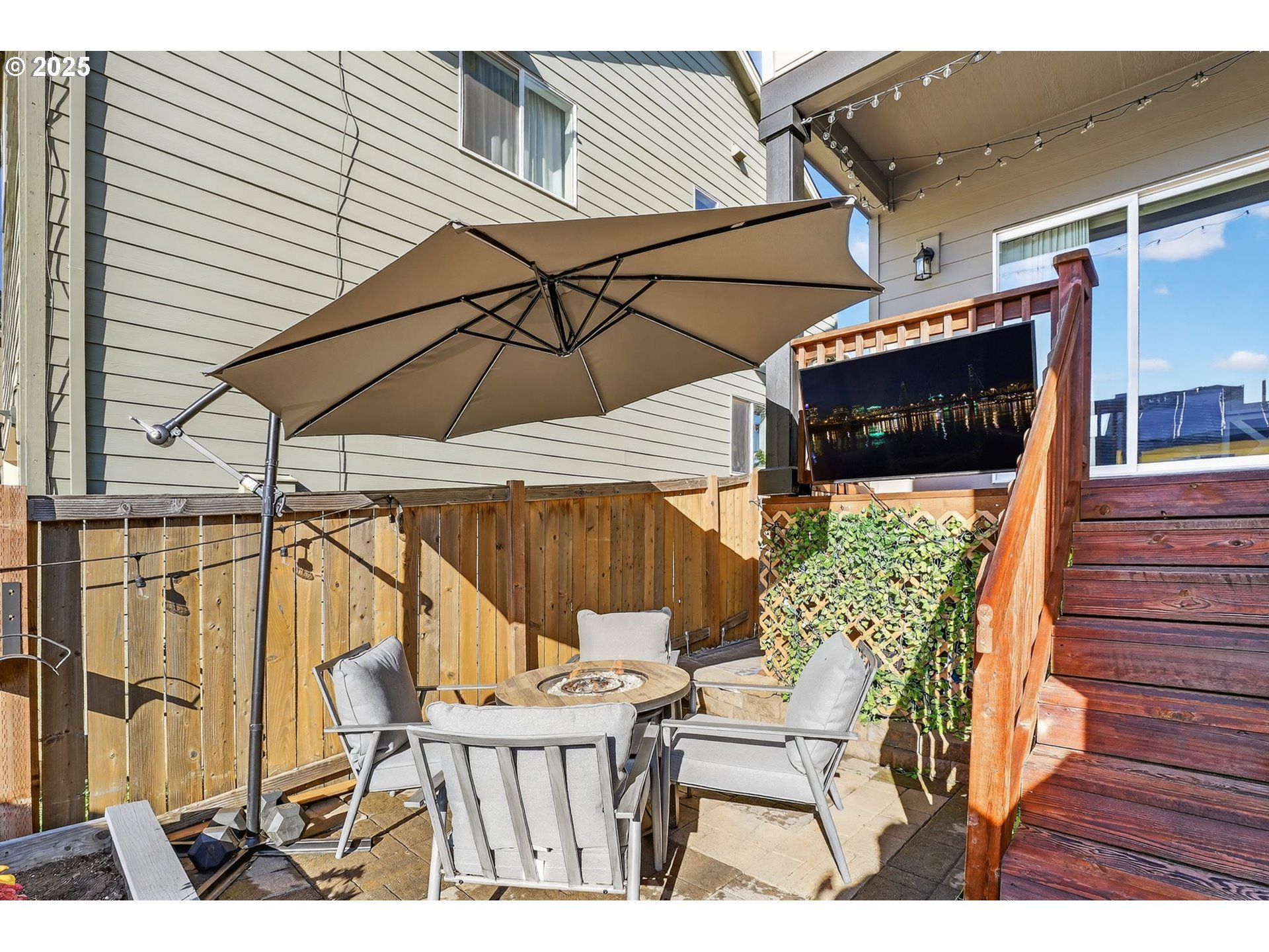 19135 Southeast Village Boulevard Sandy, OR 97055 - Photo 37 of 43 a view of balcony with two chairs and a umbrella