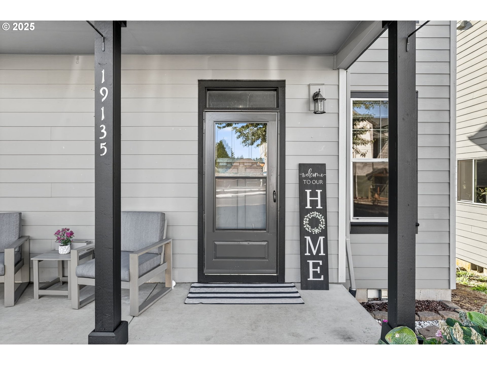19135 Southeast Village Boulevard Sandy, OR 97055 - Photo 4 of 43 a black and white photo of a living room