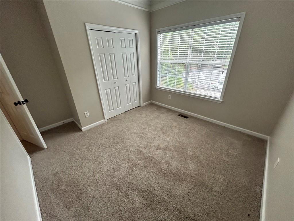 95 Luke Drive Dallas, GA 30132 - Photo 11 of 15 an empty room with windows