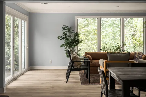a view of a dining room with furniture window and wooden floor