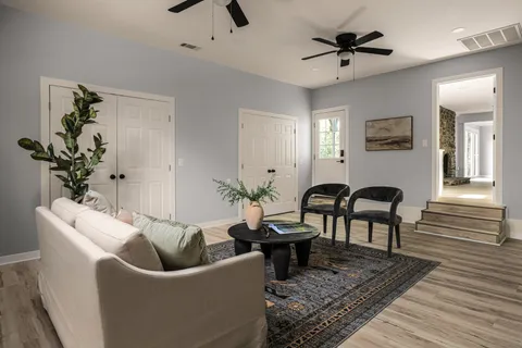 a living room with furniture and a rug