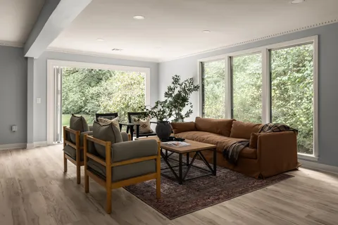 a living room with furniture and a large window