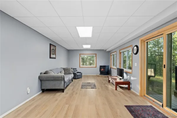 a living room with furniture large window and outer view