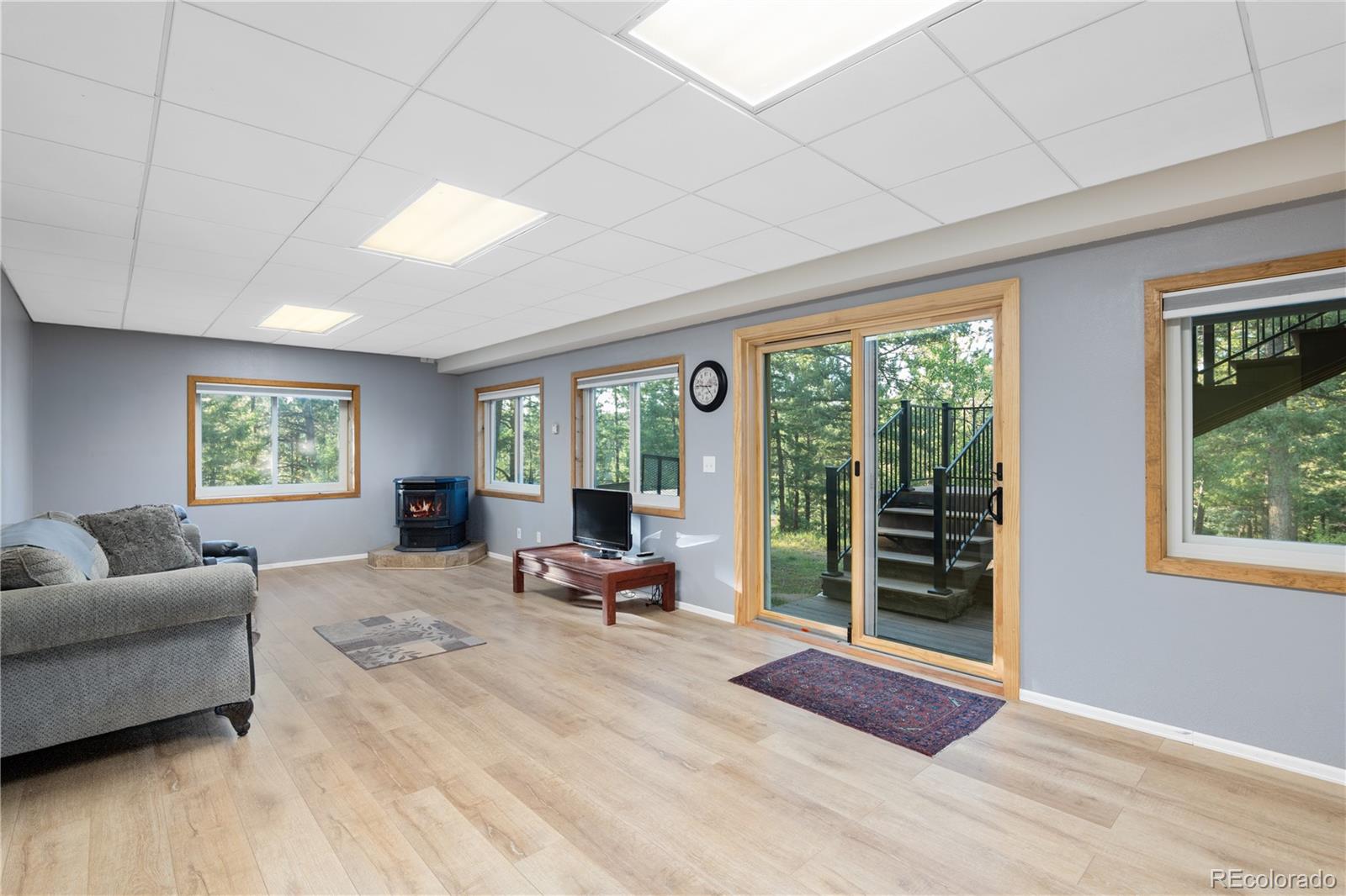 20065 Spring Creek Road Buffalo Creek, CO 80425 - Photo 25 of 41 a living room with furniture and a large window